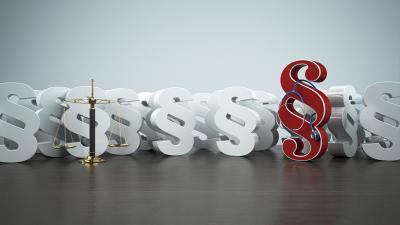 Medizinrecht: viele Paragraphen-Zeichen mit Waage und Stethoskop